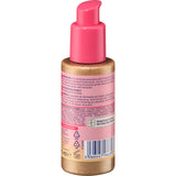 Balea Tropical Dream Body-Fluid in einer 75 ml Flasche mit pinkem Pumpspender und schimmerndem, goldfarbenem Inhalt.