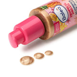Balea Tropical Dream Body-Fluid in einer pinken Pumpflasche mit drei golden schimmernden Tropfen auf weißem Hintergrund.