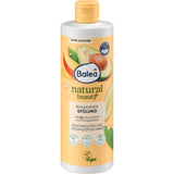 Balea Natural Beauty Spülung mit Avocadoöl und Mangobutter in einer 350 ml Flasche mit gelbem Deckel und veganem Label.