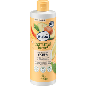 Balea Natural Beauty Spülung mit Avocadoöl und Mangobutter in einer 350 ml Flasche mit gelbem Deckel und veganem Label.