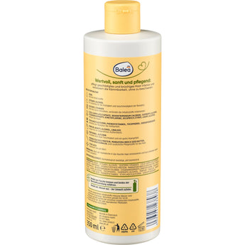Rückseite der Balea Natural Beauty Spülung mit Avocadoöl und Mangobutter, 350 ml Flasche mit gelbem Klappdeckel.