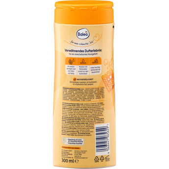 Rückseite einer 300 ml Balea Cremedusche Milch & Honig Flasche mit gelbem Verschluss, Inhaltsstoffen und Produktinformationen.