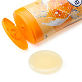Balea Cremedusche Milch & Honig 300ml Flasche mit geöffnetem Deckel und einem Klecks cremiger Duschgel-Textur auf weißem Grund.
