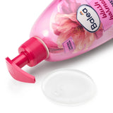 Rosa Balea Cremeseife Blush Harmony 500 ml mit Kirschblüten-Design und transparentem Flüssigseifen-Klecks auf weißem Grund.
