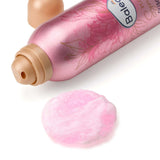 Rosa Balea Duschschaum Floral Symphony Dose mit blumigem Design und einem Klecks zartrosa Reinigungsschaum auf weißem Grund.
