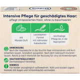 Rückseite der Balea Fester Conditioner Verpackung mit Anwendungshinweisen, Inhaltsstoffen und grünen Icons auf beigem Karton.
