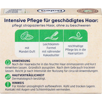 Rückseite der Balea Fester Conditioner Verpackung mit Anwendungshinweisen, Inhaltsstoffen und grünen Icons auf beigem Karton.