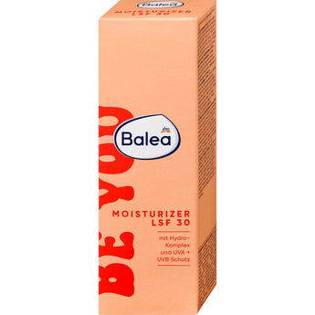 Balea be you Gesichtscreme in pfirsichfarbener 50 ml Verpackung mit LSF 30 und auffälligem roten Schriftzug.