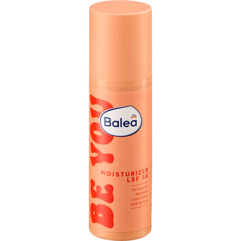 Pfirsichfarbener Balea be you Moisturizer Pumpspender mit LSF 30, 50 ml Inhalt und roter Schrift auf weißem Hintergrund.