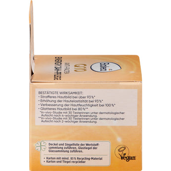 Balea Energy Q10 24h Gesichtscreme Verpackung in Orange mit Wirkversprechen und Vegan-Siegel auf der Rückseite.