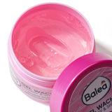 Offener Tiegel mit Balea Glossy & Shine Gel-Wachs, rosa Textur, 75 ml, mit abgenommenem pinkem Deckel auf weißem Hintergrund.