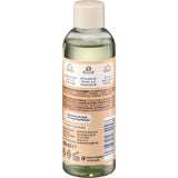 Rückseite der 100 ml Balea Massageöl Sweet Embrace Flasche mit beigem Etikett, Inhaltsstoffen und Anwendungshinweisen.