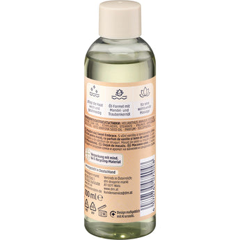 Rückseite der 100 ml Balea Massageöl Sweet Embrace Flasche mit beigem Etikett, Inhaltsstoffen und Anwendungshinweisen.